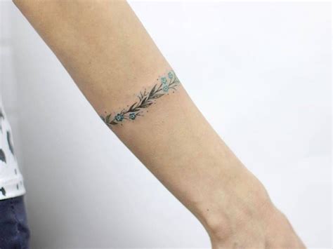 Your a z guide to flower tattoo meanings symbolisms and. Forget-me-not bracelet tattoo on the left forearm. | Wrist ...