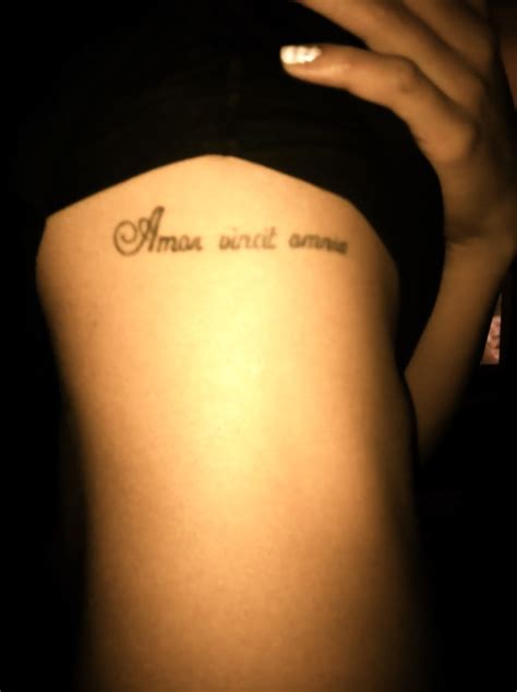 amor vincit omnia love conquers all rib tattoo tattoo quotes get a tattoo