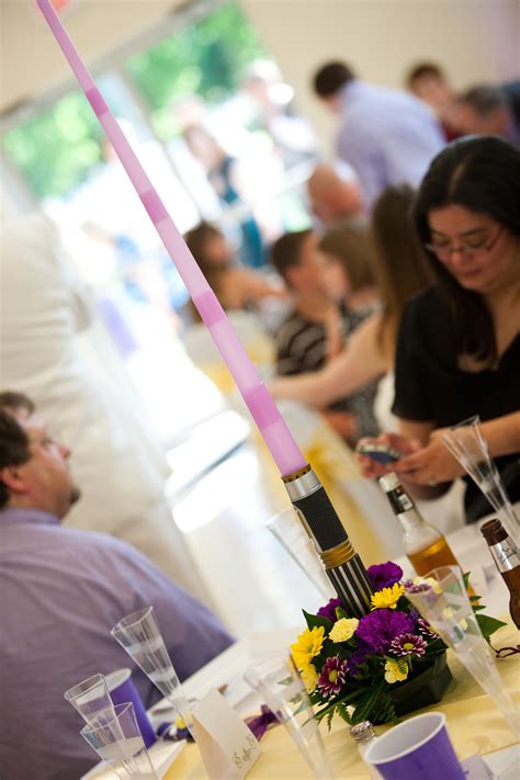 Fresh flowers and gifts are a great gift. Light saber flower arrangements! | Star wars wedding theme ...