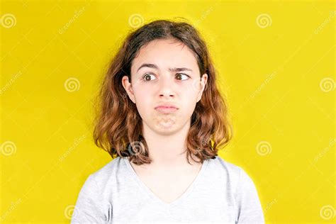 Cute Curly Teenager Girl With Funny Face Surprise And Shock Stock