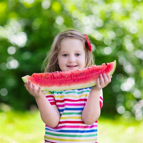 Little Girl Eating Watermelon In The Garden Stock Image Image Of
