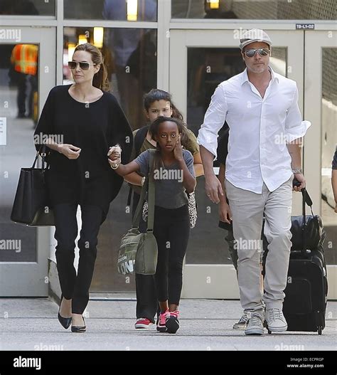 Brad Pitt And Angelina Jolie Arrive At Los Angeles International Lax Airport With Their