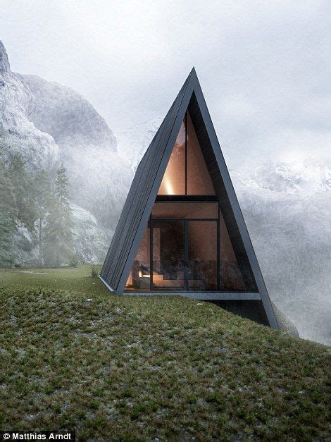 This Triangular House With A Glass Balcony Is Nestled Into A Cliff