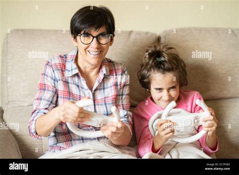 Mother And Daughter Playing Video Games At Home Stock Photo Alamy