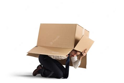 Premium Photo Afraid Businessman Is Hiding Under A Cardboard