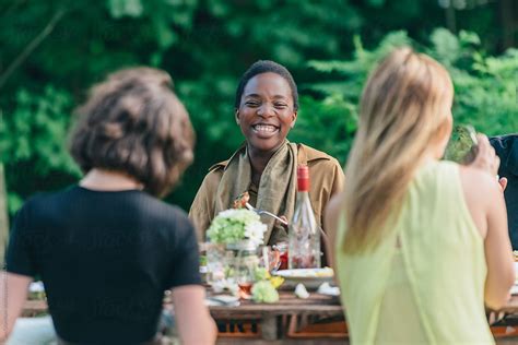Adorable Woman Laughing At Dinner Party By Stocksy Contributor Jen Grantham Stocksy