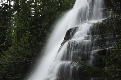 A long heavy southbound whips by station name sign brackendale (north of squamish). The highest waterfall in Canada is Della Falls, British ...