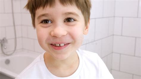 Happy Child Looks At The Camera And Smiles Cute Caucasian 6 Year Old