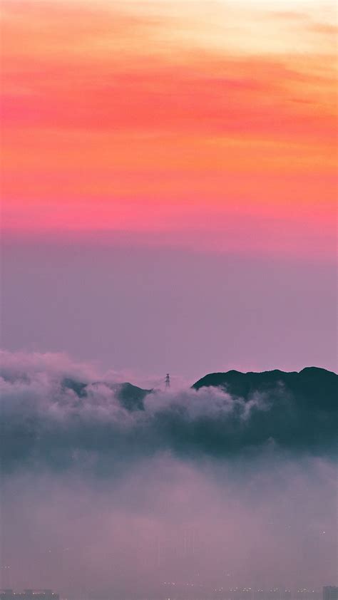 Download Wallpaper 1350x2400 Clouds Sunrise Mountain Dawn Fog City