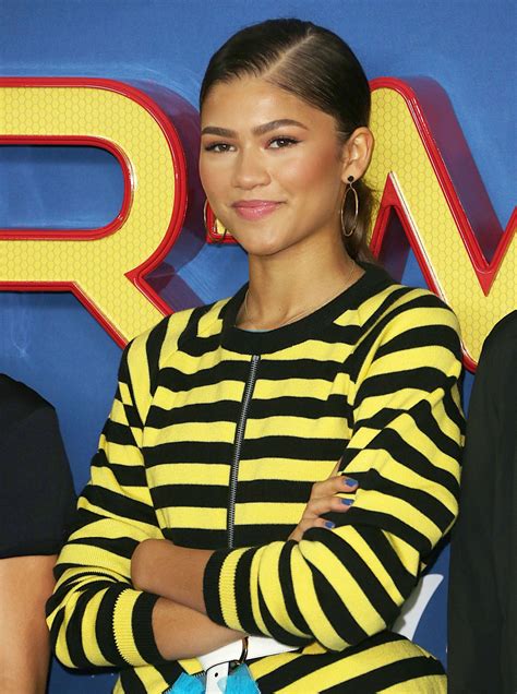 Zendaya and tom holland in spiderman suit swing into action up in the air as they are lifted with wires while filming spiderman Zendaya - "Spider-Man: Homecoming" Movie Photocall in ...