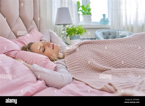 Daytime Sleep Mature Woman Sleeping On Bed Stock Photo Alamy