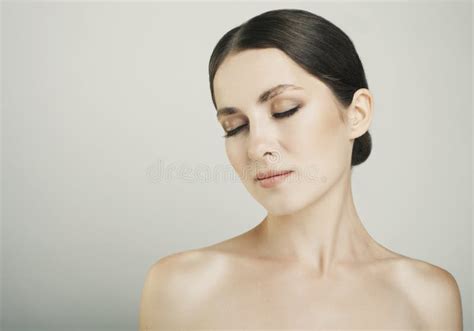 Pretty Girl With Close Eyes And Dark Eyebrows With Naked Shoulders