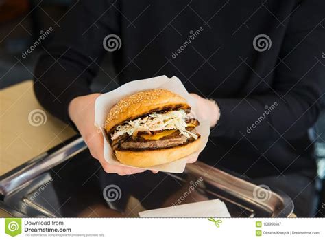 Normally, when i make hamburgers, i opt for the grill, but sadly, our grill is buried under snow. Close Up Female Hands Holding Fast Food Beef Burger On ...