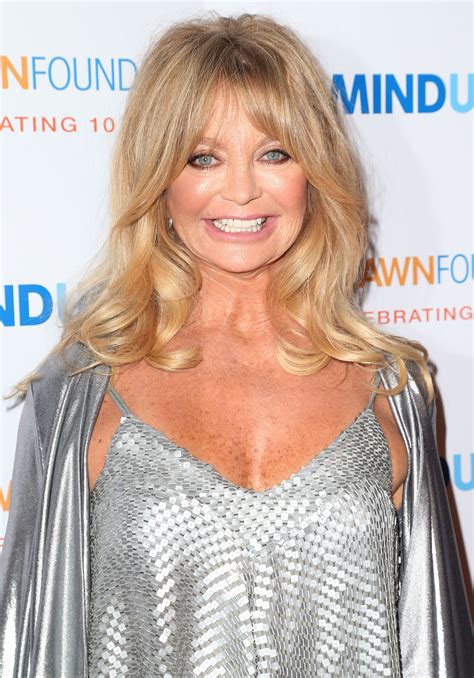 goldie hawn shows off her lacy underwear during an airport wardrobe malfunction — see the pics
