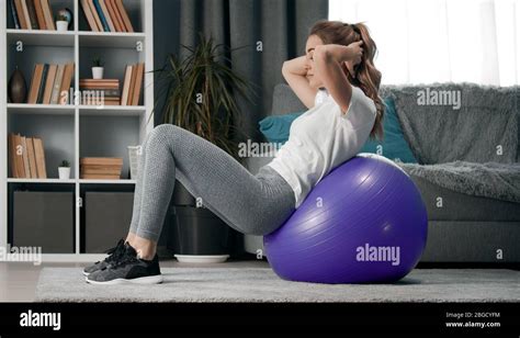 Woman Leaning Backwards On Fitball Stock Photo Alamy