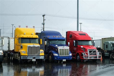 Semi Trucks Parked In The Rain Stock Editorial Photo