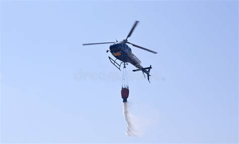 Helicopter With Water Tank When Used Against The Fire In Portugal