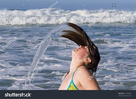 Bikini Model Fling Her Head Back With Hair Drenched In Water Stock