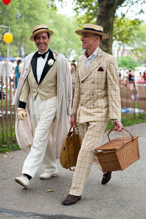 roaring 20s fashion two smiling men wearing cream and white 1920s suits and falttop hats