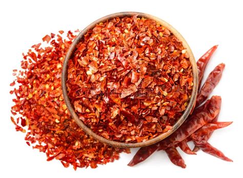 Dried Red Chilli Flakes In The Wooden Bowl Isolated On White Top View