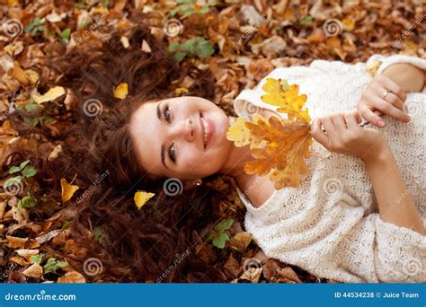 Woman Lying On Autumn Leaves Outdoor Portrait Stock Photo Image Of