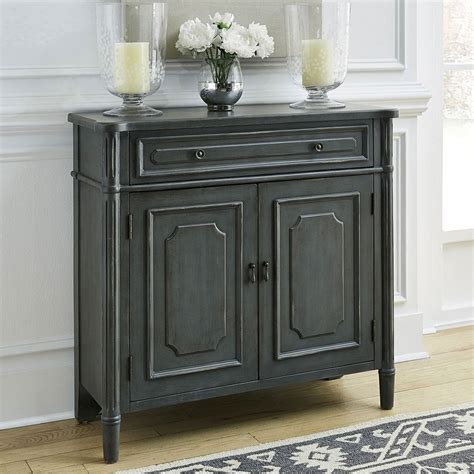 The functional piece of furniture typically is called a sideboard when it's placed in a dining room and a buffet if it's stationed in a living room. Amber Accent Cabinet by Liberty Furniture | FurniturePick