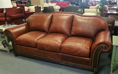 Item 26285 1 Brown Leather Sofa W Nailhead Trim Distressed Wood Trim