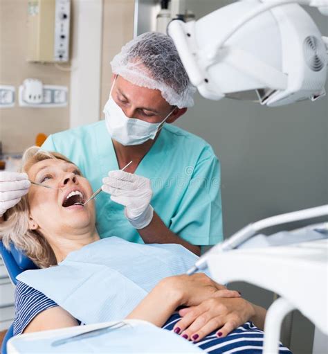 Male Dentist With Female Patient During Checkup Stock Image Image Of