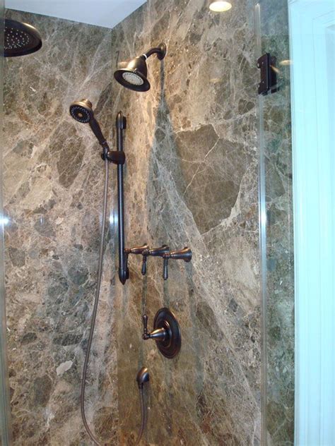 Design shower walls using emperador dark marble in mosaic style. Lifetime Home Enhancements | Marble showers, Shower panels, Marble shower walls