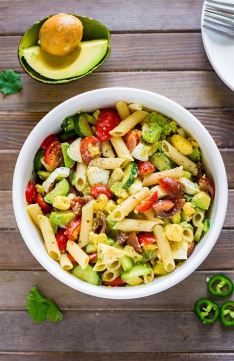 Transfer the boiled pasta in a bowl and add in the chopped tomato, chopped cucumber, finely chopped onion, olives, and yellow bell pepper. Deviled Egg Pasta Salad with Avocado Recipe | ChefDeHome.com