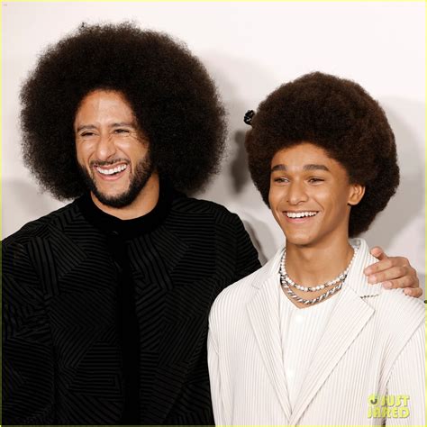 colin kaepernick poses with jaden michael at the premiere of colin in black and white photo