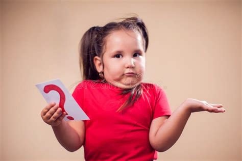 A Portrait Of Kid Girl Holding Card With Question Mark Childhood And