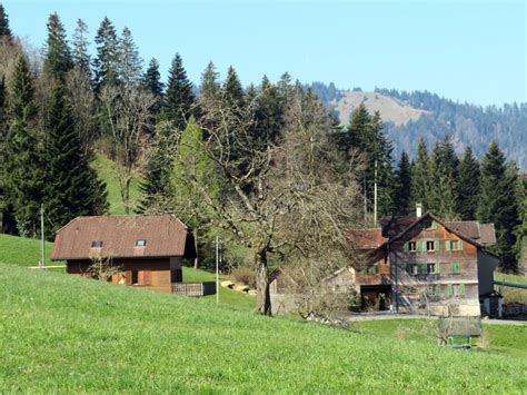 Old Traditional Houses And Typical Swiss Subalpine Rural Architecture