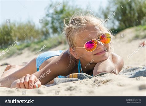 Teenage Girl Sunbathing On Beach Stock Photo 615050192 Shutterstock