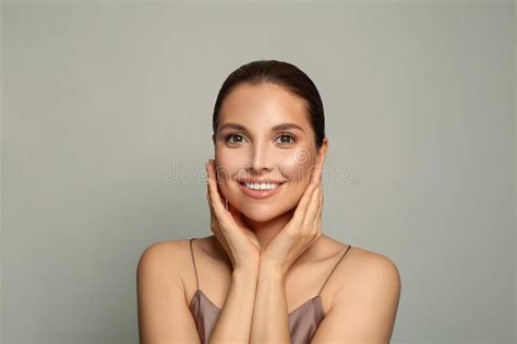 Attractive Woman With Clean Fresh Skin Touching Her Face Facial