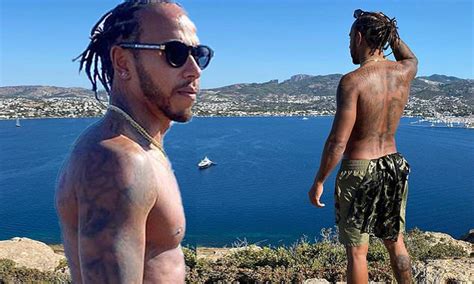 Lewis Hamilton Displays His Ripped Physique As He Reaches The Summit On