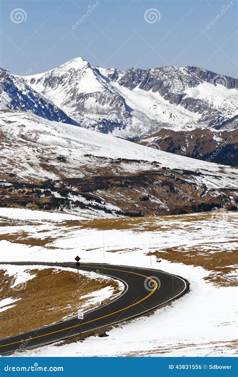 Winding Road Through Snow Covered Mountains Stock Photo Image Of