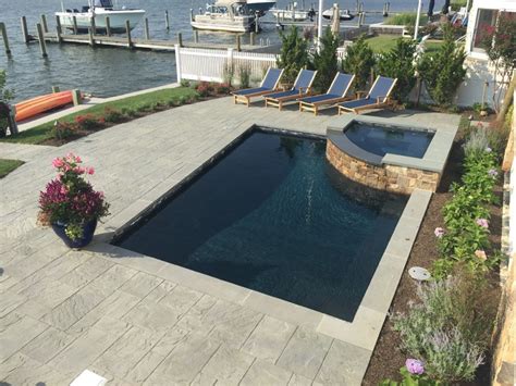 White marble rolled and black polished pebbles in contrast with each other.careful on the white it is easy to get dirty.the black does not fade or lose its. Pebble Fina Pool Finishes - Pebble Tec