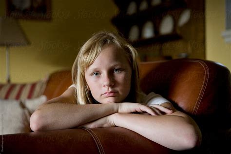 Beautiful Blonde Teen Resting Her Head On Couch By Stocksy Contributor Dina Marie