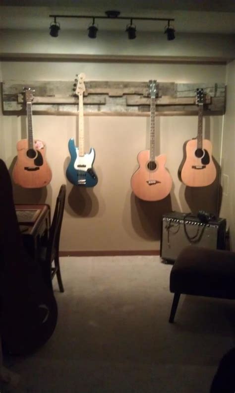 The arms that would hold the guitar neck where spaced at 4 1/2 cm , but. guitar wall hanging made out of a pallet, backlit with rope lights:) Cool!! | Guitar wall ...