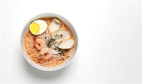 Laksa consists of thick wheat noodles or rice vermicelli with chicken, prawn or fish. Singapore laksa recipe | How to make laksa at home