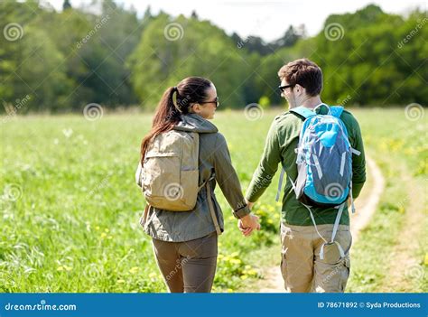 Happy Couple With Backpacks Hiking Outdoors Stock Photo Image Of