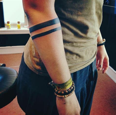 black two line band tattoo on right forearm forearm band tattoos black band tattoo band tattoo
