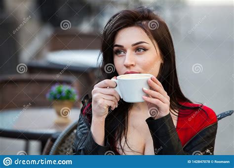Gorgeous Young Woman With Cup Of Coffee In City Street Coffee Break