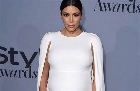 Kim Kardashian Displays Off Her Big Bump In White Dress D45