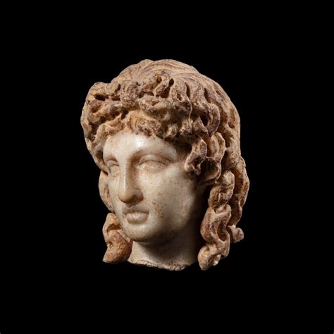 A Roman Marble Head Of The Eros Of Centocelle Circa 2nd Century Ad