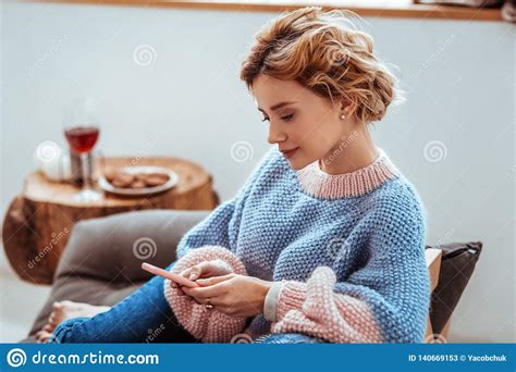 Pleasant Relaxed Woman Using Her Mobile Gadget Stock Image - Image of alone, relax: 140669153