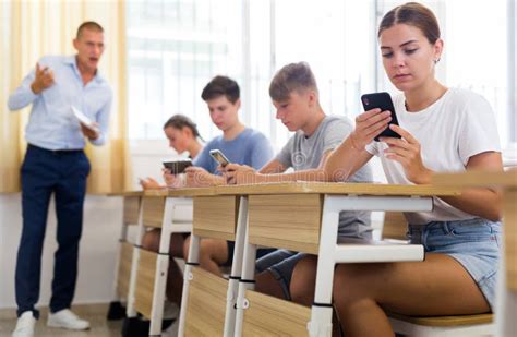 Teen Pupils Using Mobile Phones During Lesson Stock Image Image Of