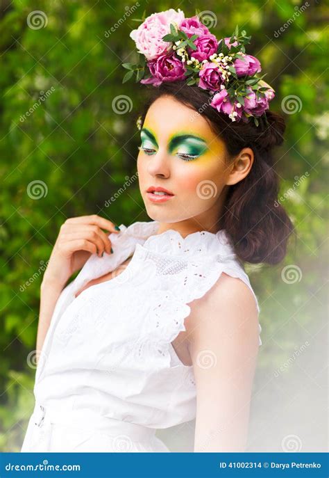 Portrait Of A Young Girl With Flowers In Her Hair Stock Photo Image