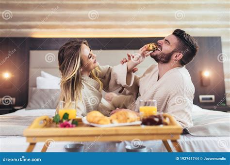 Couple Having Breakfast In Bed In Hotel Room Stock Photo Image Of